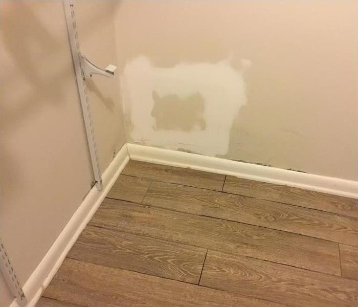 water damaged closet; drywall repaired after being damaged portion removed