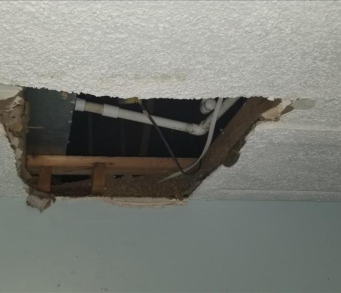 water damaged ceiling, plumbing showing