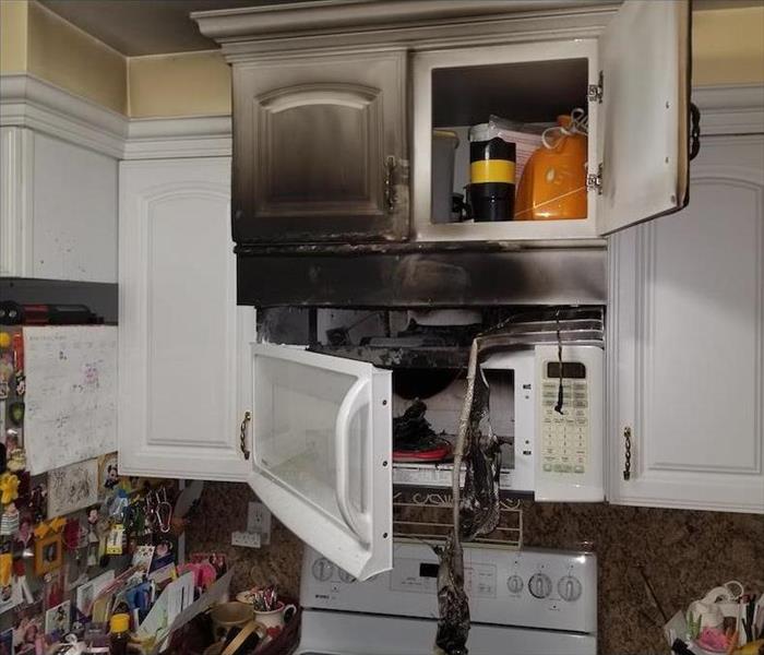 Kitchen fire with soot damage on the ceiling
