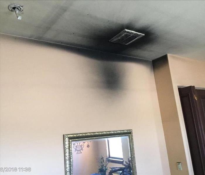 smoke and soot damage done to ceiling and walls