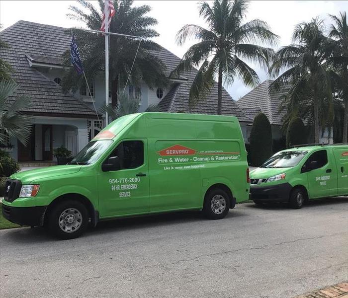 servpro vehicles parked at house