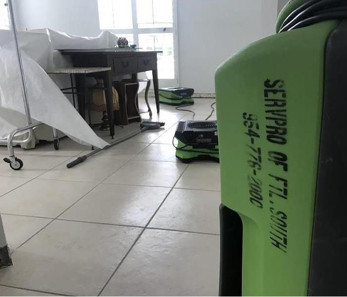 SERVPRO restoration equipment being used in water damaged room